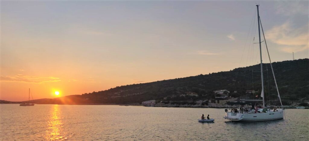 Stari Trogir sunset - white wake sailing